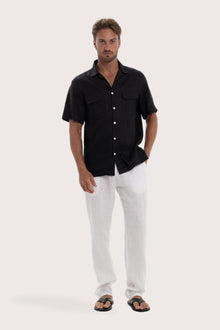 Model wearing the black linen Odyssey shirt by By The Sea Bali