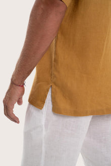 Detailed back view highlighting the relaxed silhouette and linen craftsmanship