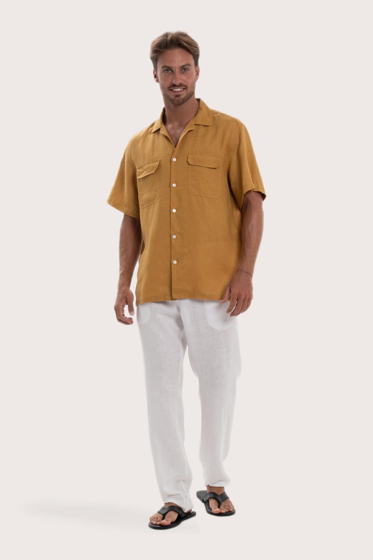 Model wearing the yellow linen Odyssey shirt by By The Sea Bali