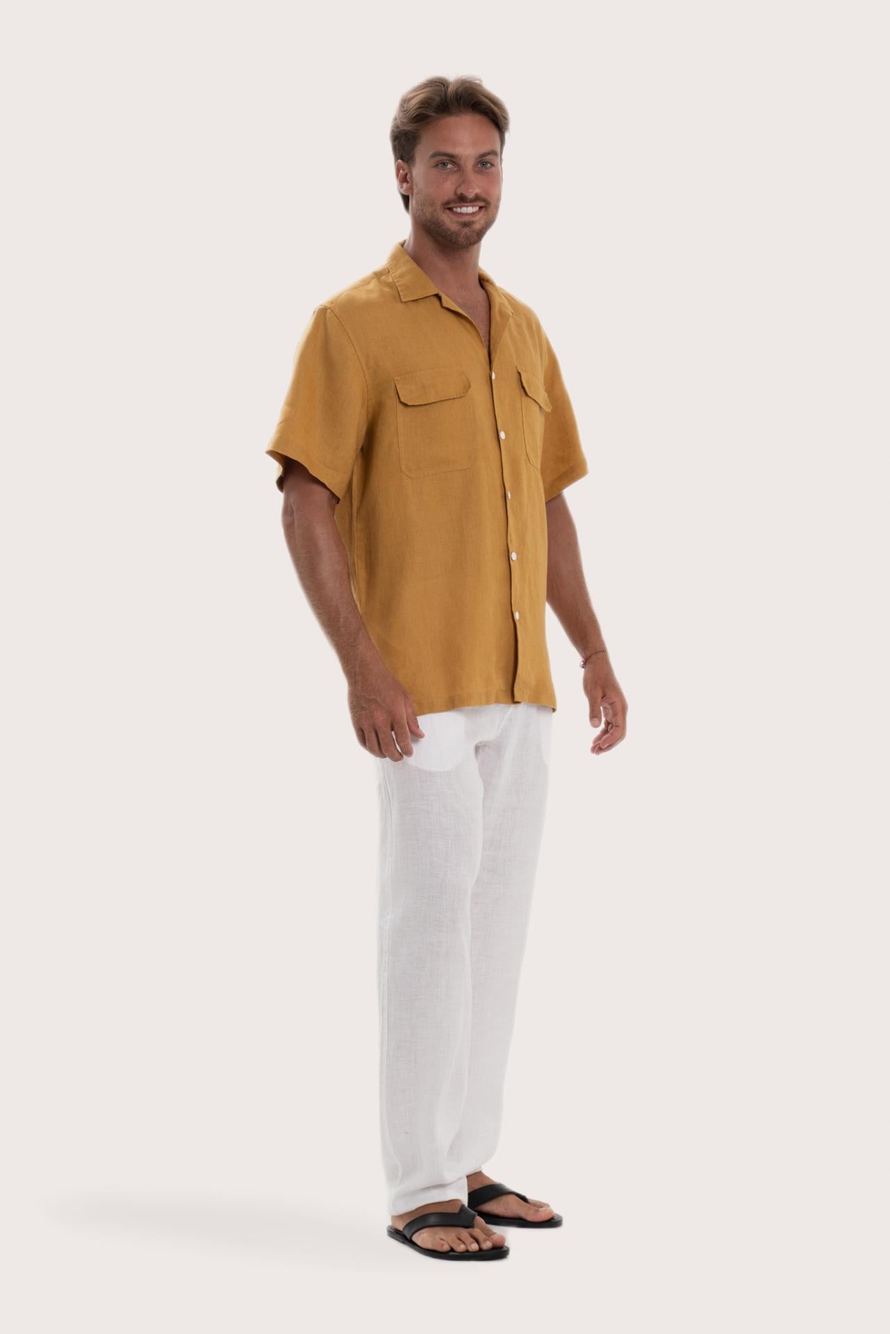 Side profile of the yellow linen shirt showcasing its effortless drape and comfortable fit