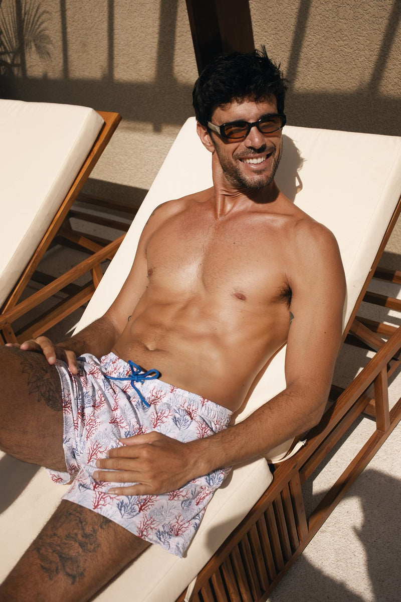 Front view of the Paco Swim Trunk in Coral Light Blue print by By The Sea Bali