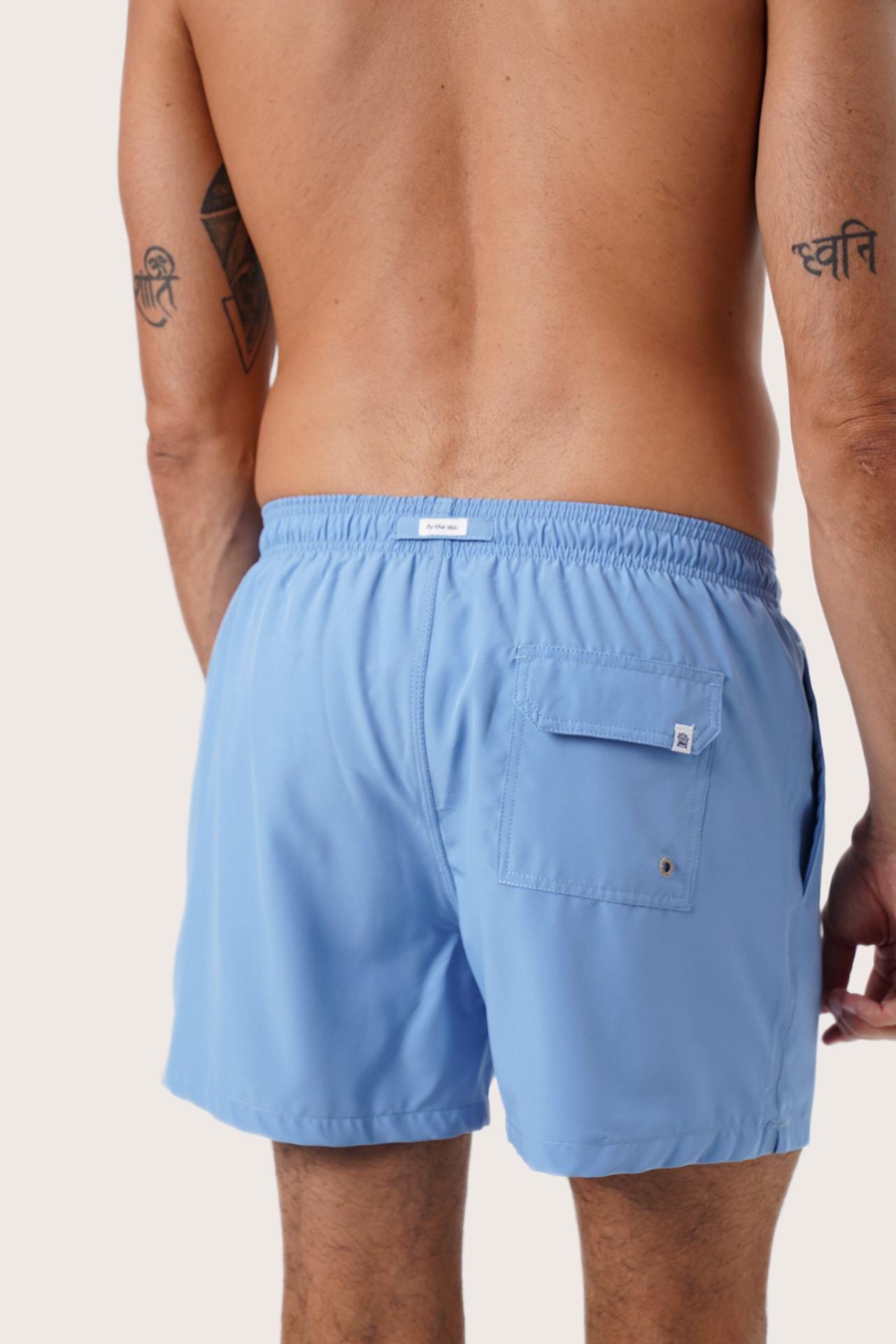 Full view of the Light Blue Paco Swim Trunk — versatile resort swimwear by By The Sea Bali