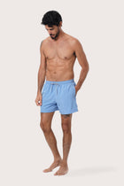 Side view of the Paco Swim Trunk in Light Blue with elastic waistband detail by By The Sea Bali