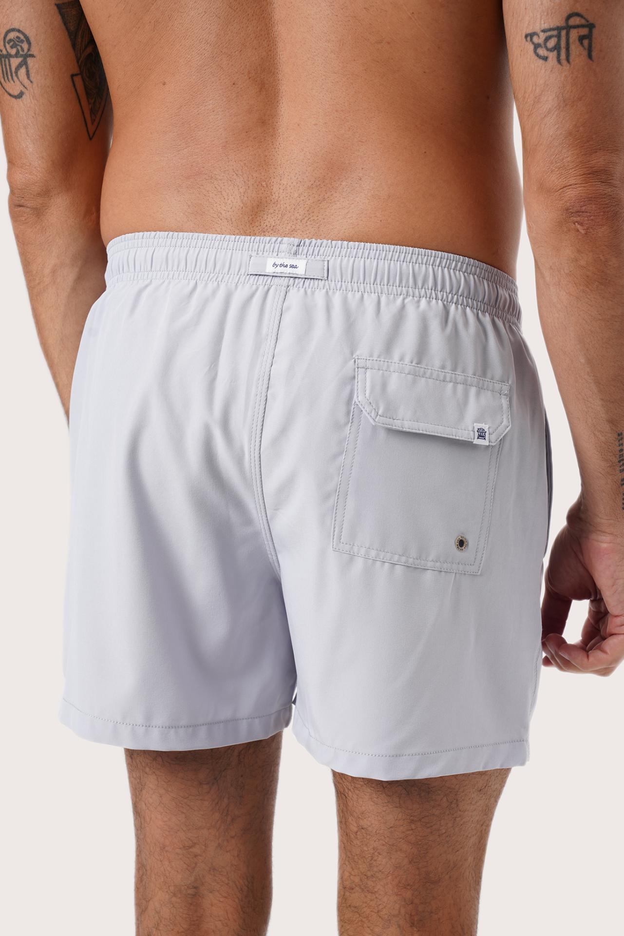 Men's beachwear styling featuring the Paco Swim Trunk in Light Grey by By The Sea Bali