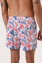 Men's beachwear styling featuring the Paco Swim Trunk in Lobster and Sea White by By The Sea Bali