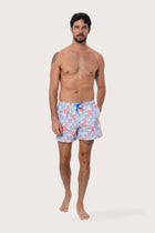 By The Sea Bali Paco Swim Trunk in Pastel Coral Light Blue — quick-dry men's swim shorts in a soft coral print