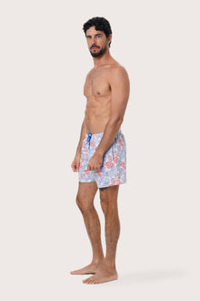 Front view of the Paco Swim Trunk in Pastel Coral Light Blue print by By The Sea Bali
