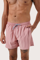 Side view of the Paco Swim Trunk in Pastel Pink with elastic waistband detail by By The Sea Bali
