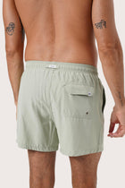 Men's beachwear styling featuring the Paco Swim Trunk in Sage by By The Sea Bali