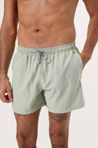 Side view of the Paco Swim Trunk in Sage with elastic waistband detail by By The Sea Bali