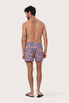 Side view of the Paco Swim Trunk in Spring Flora Orange with elastic waistband detail by By The Sea Bali