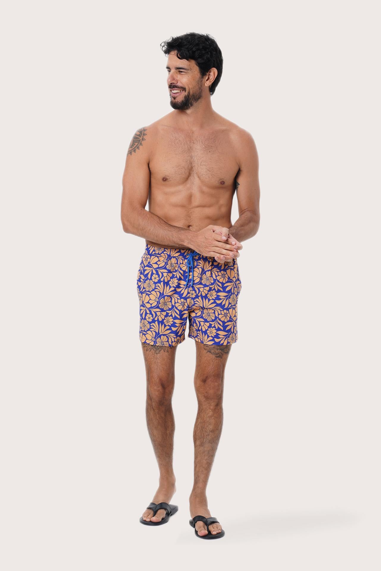 Front view of the Paco Swim Trunk in Spring Flora Orange print by By The Sea Bali