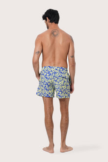Side view of the Paco Swim Trunk in Spring Flora Yellow Lime with elastic waistband detail by By The Sea Bali