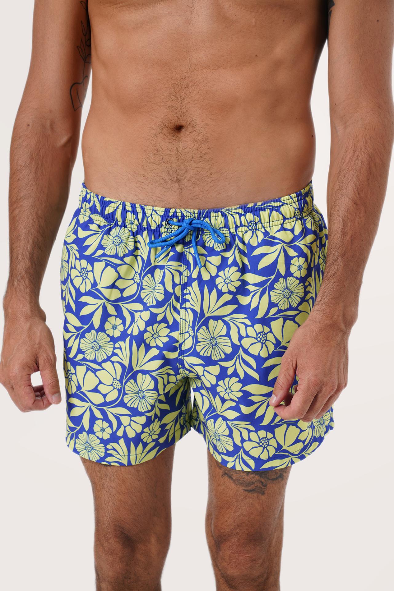 Men's beachwear styling featuring the Paco Swim Trunk in Spring Flora Yellow Lime by By The Sea Bali