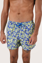 Men's beachwear styling featuring the Paco Swim Trunk in Spring Flora Yellow Lime by By The Sea Bali