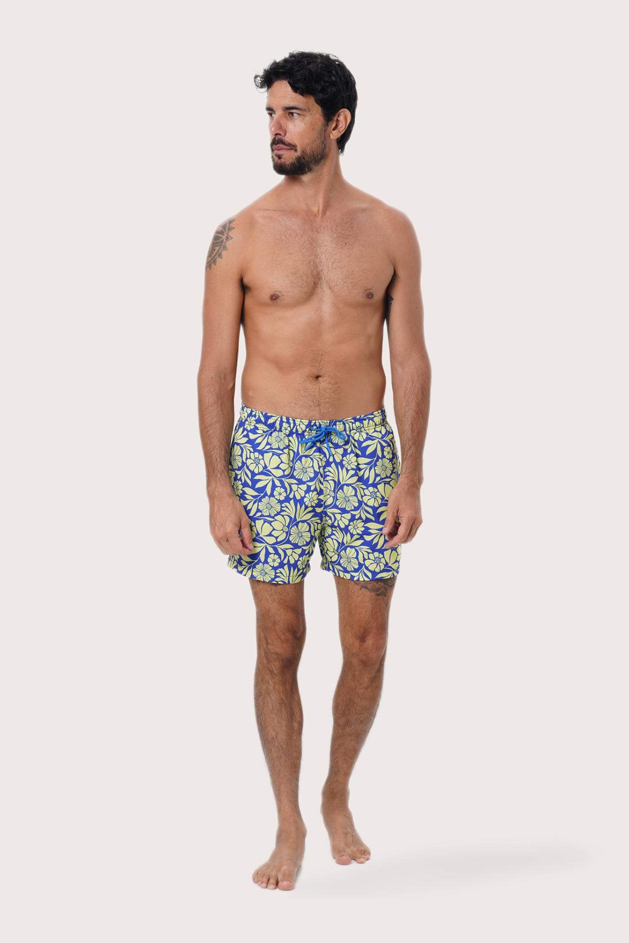 Front view of the Paco Swim Trunk in Spring Flora Yellow Lime print by By The Sea Bali