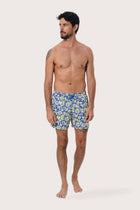 Front view of the Paco Swim Trunk in Spring Flora Yellow Lime print by By The Sea Bali