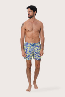 Front view of the Paco Swim Trunk in Spring Flora Yellow Lime print by By The Sea Bali