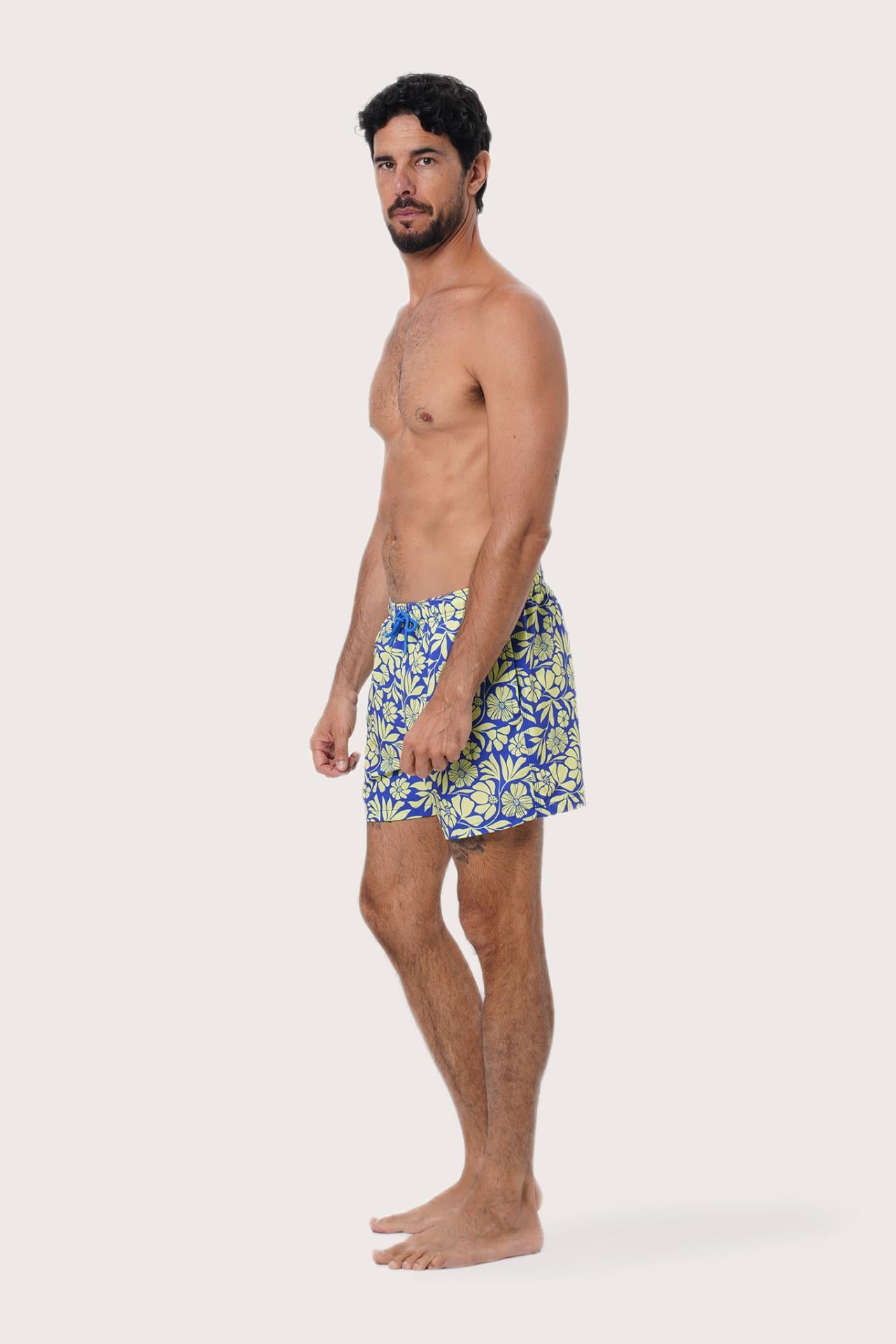 Close-up of the Spring Flora Yellow Lime floral print on the Paco Swim Trunk by By The Sea Bali