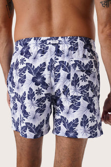Men's beachwear styling featuring the Paco Swim Trunk in Summer Palm Navy by By The Sea Bali