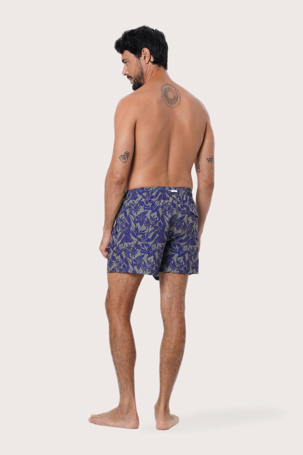 Men's beachwear styling featuring the Paco Swim Trunk in Tropic Garde Blue by By The Sea Bali