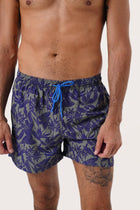Lifestyle view of the Tropic Garde Blue Paco Swim Trunk for easy poolside days by By The Sea Bali