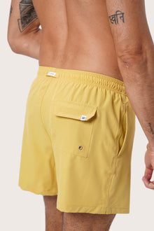 Back view of the Yellow Paco Swim Trunk showing the pocket detail by By The Sea Bali