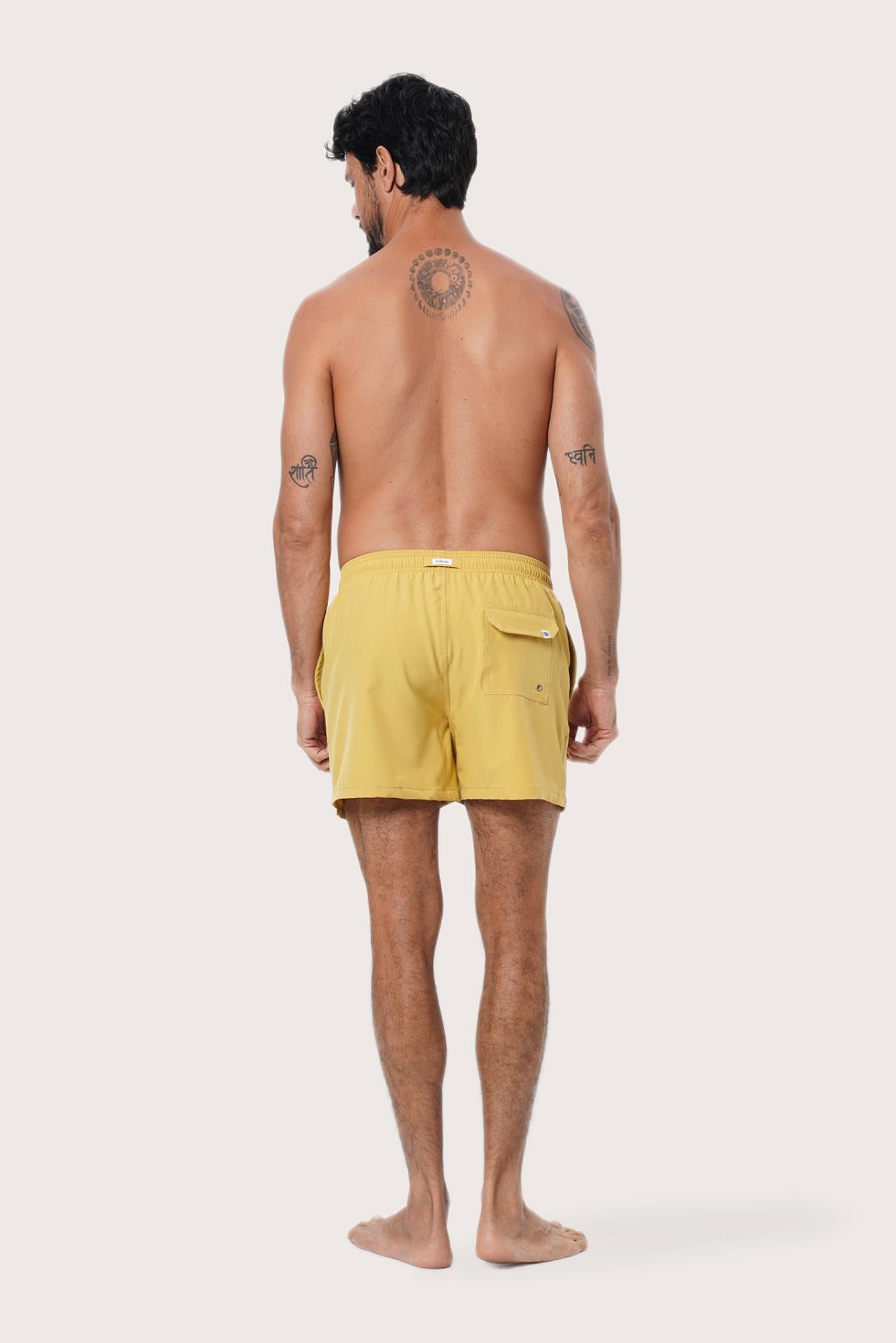 Fabric and stitching detail of the Yellow Paco Swim Trunk by By The Sea Bali