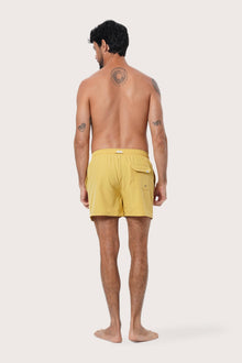 Fabric and stitching detail of the Yellow Paco Swim Trunk by By The Sea Bali
