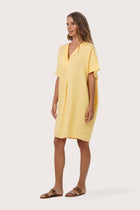 Side profile of the Padar Linen Dress Lymun showing its cut and natural movement