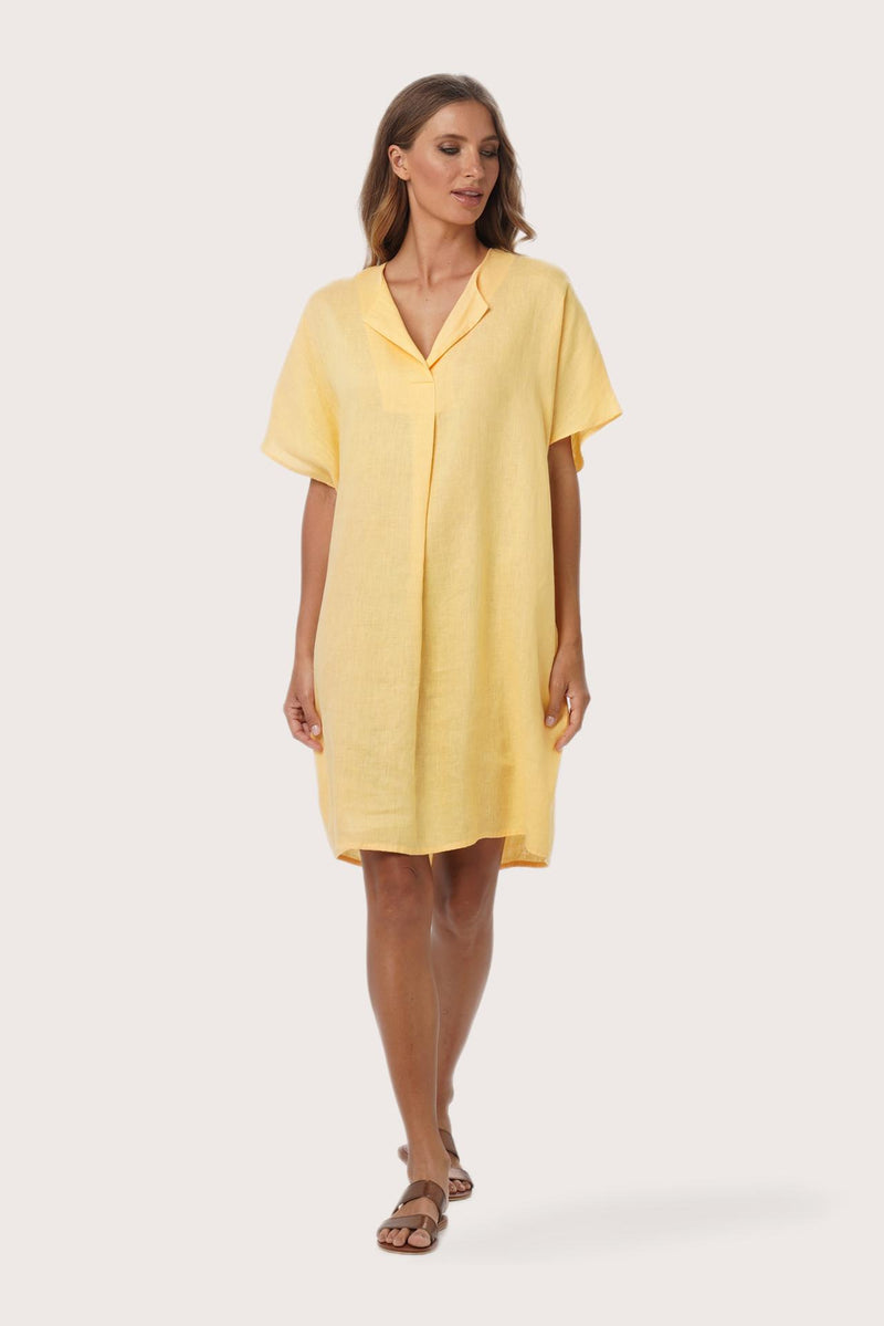 Woman wearing the Padar Linen Dress Lymun designed for effortless resortwear and tropical living by By The Sea Bali