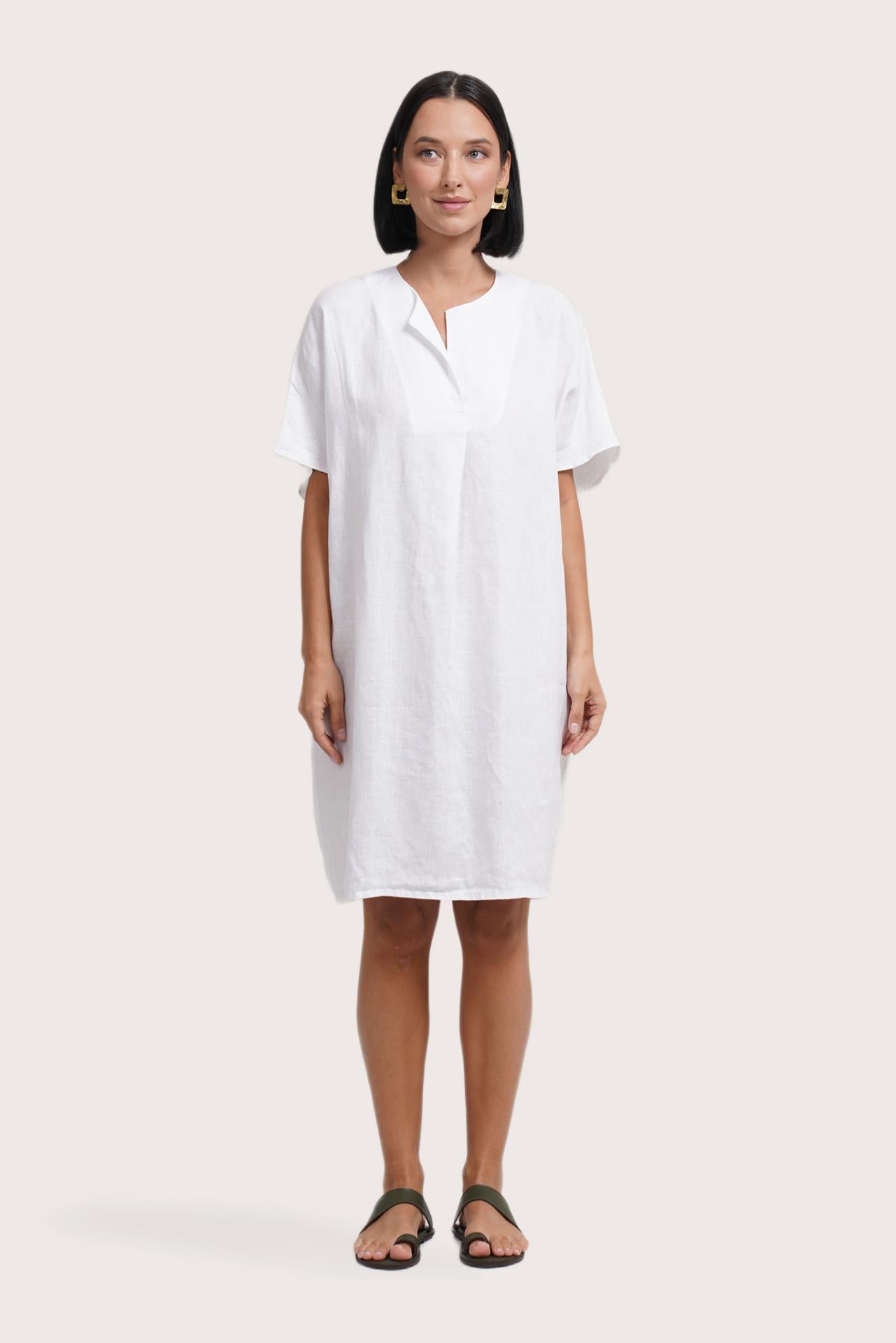 Woman wearing the Padar Linen Dress White designed for effortless resortwear and tropical living by By The Sea Bali