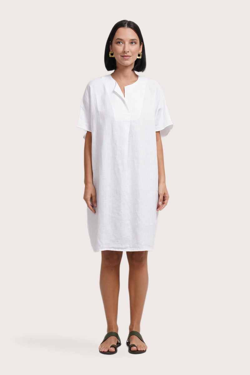 Woman wearing the Padar Linen Dress White designed for effortless resortwear and tropical living by By The Sea Bali