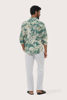 Side profile of the Panta Cotton Shirt in Hibiscan Batik Green showing its relaxed fit by By The Sea Bali