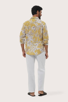 Side profile of the Panta Cotton Shirt in Hibiscan Batik Yellow showing its relaxed fit by By The Sea Bali