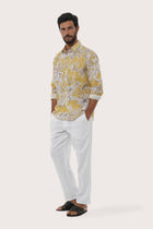 Close-up of the Hibiscan Batik Yellow print on the Panta Cotton Shirt by By The Sea Bali