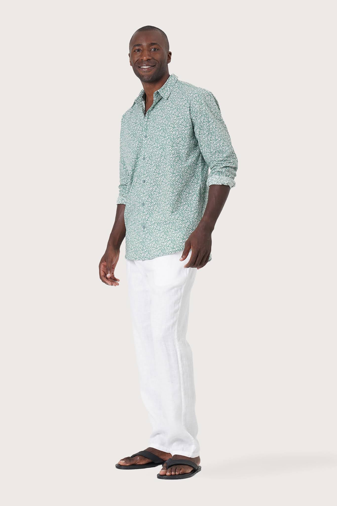 Side-angle view of the Panta Cotton Shirt Summer Flora Spring Bliss Green showing its relaxed drape by By The Sea Bali