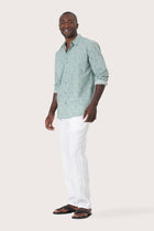 Side-angle view of the Panta Cotton Shirt Summer Flora Spring Bliss Green showing its relaxed drape by By The Sea Bali