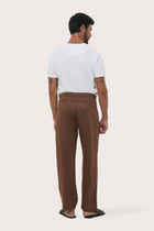 Parha Linen Pant in warm Brown showcasing the unique welt back pocket and natural linen drape by By The Sea Bali