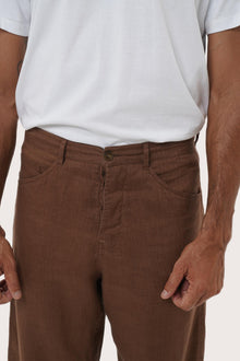 Full-length view of the Parha Brown Linen Pant — elevated men's resortwear essential by By The Sea Bali