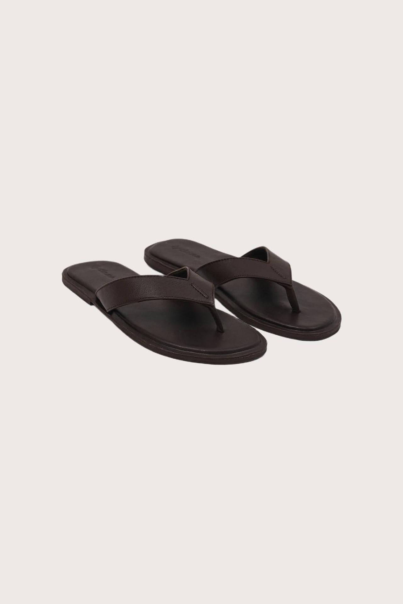 Paros leather sandals in marrone front view showcasing elegant leather straps and minimalist resort aesthetic