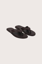 Paros leather sandals in marrone front view showcasing elegant leather straps and minimalist resort aesthetic