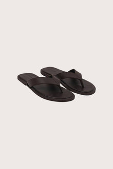 Paros leather sandals in marrone front view showcasing elegant leather straps and minimalist resort aesthetic