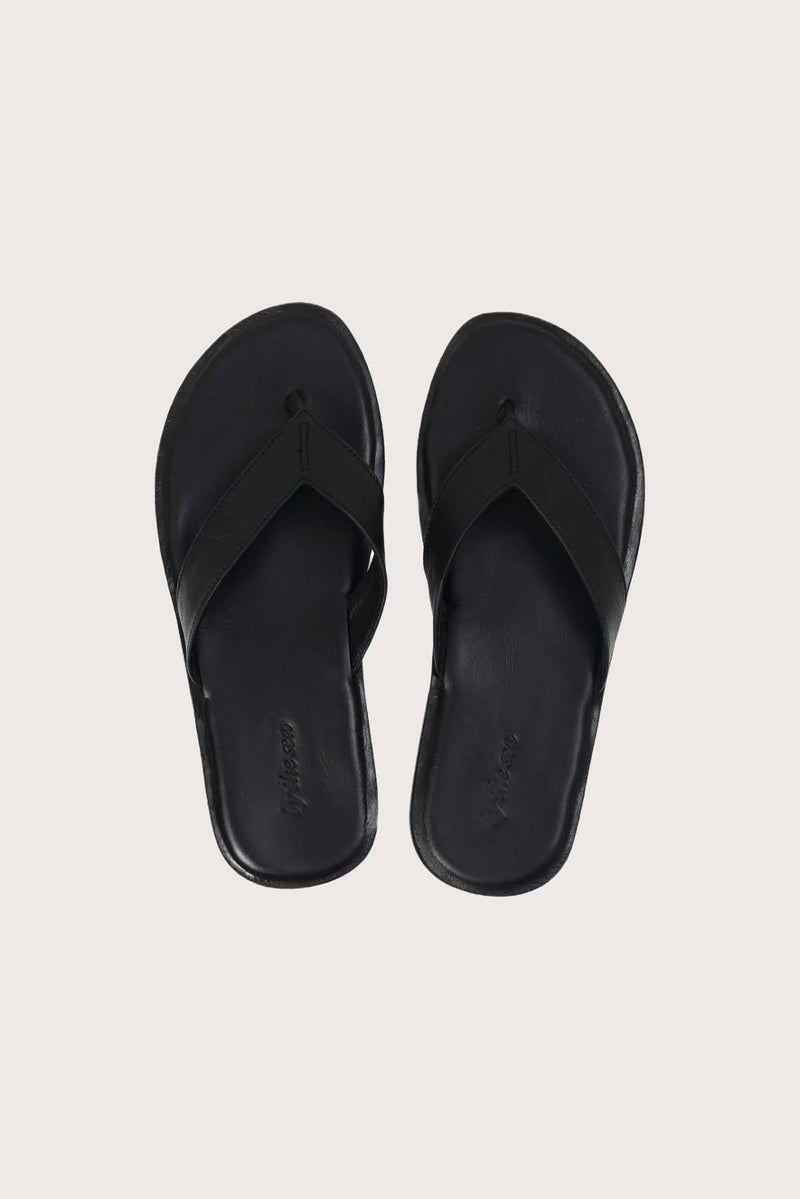 Paros leather sandals in nero shown in a global view highlighting their full silhouette and refined resort design