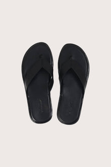 Paros leather sandals in nero shown in a global view highlighting their full silhouette and refined resort design