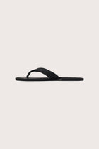 Side profile of Paros leather sandals in nero highlighting sleek and modern resort footwear silhouette