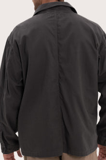 Detailed back view highlighting the relaxed silhouette and cotton craftsmanship