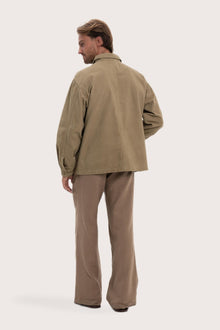 Back view of the khaki cotton jacket with a relaxed and contemporary silhouette