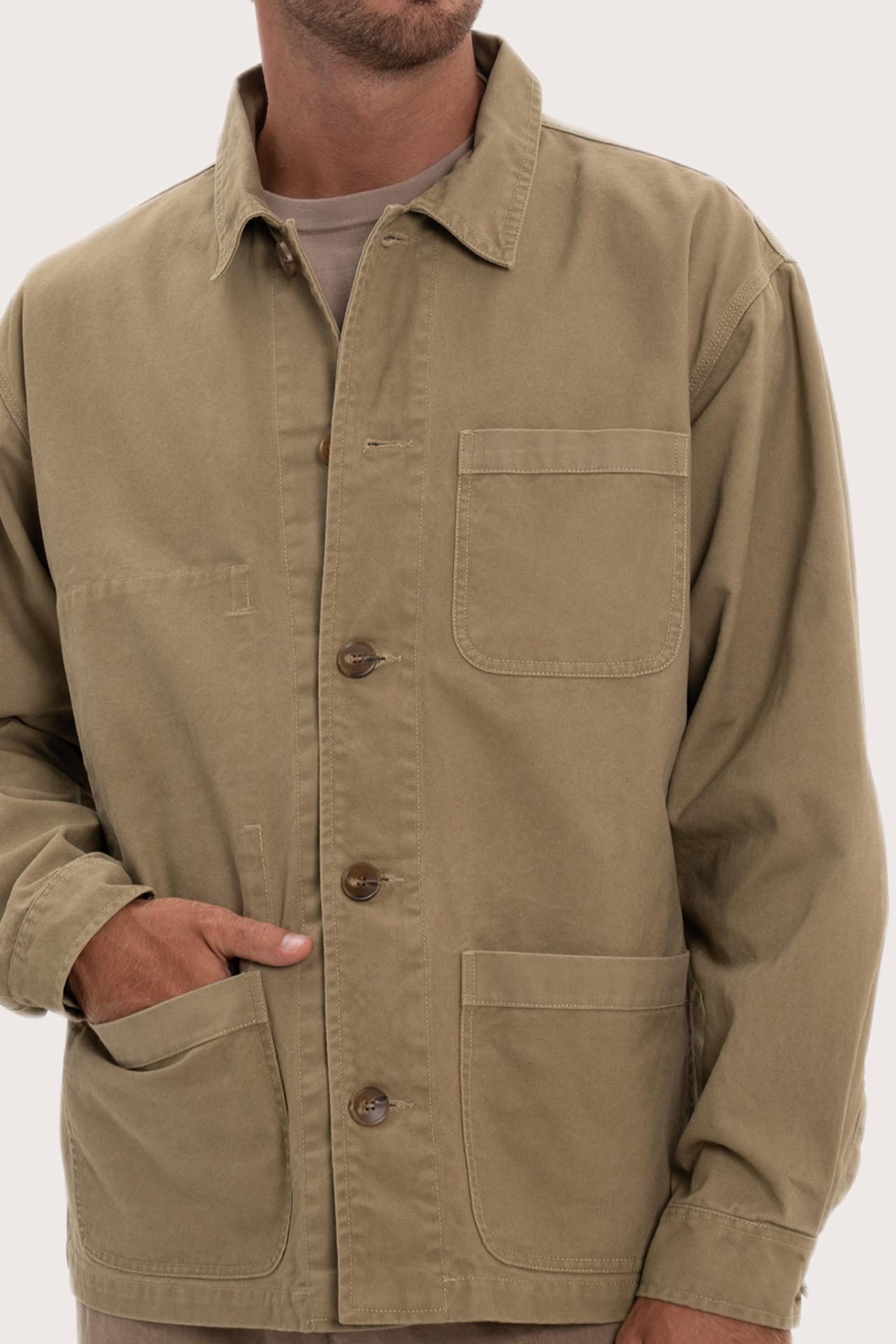 Close-up of the cotton fabric texture and refined jacket detailing in khaki