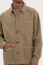 Close-up of the cotton fabric texture and refined jacket detailing in khaki
